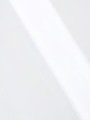 Soft Diagonal Light and Shadow on White Surface