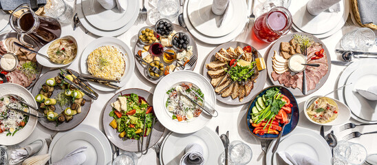 Festive banquet table with assorted traditional dishes