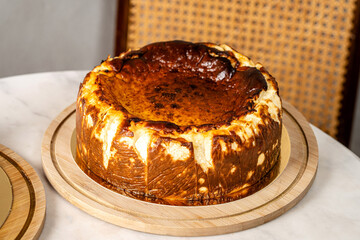 Basque burnt cheesecake on wooden board