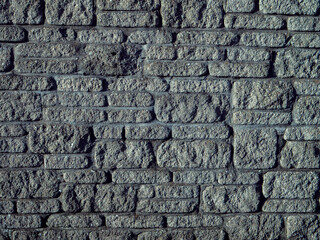 Grey color stone brick wall. Abstract background for design.