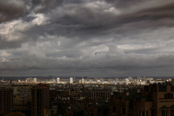 Naklejka premium Epic wide panorama of city skyline under storm clouds