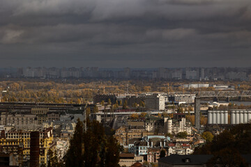 Wide panoramic skyline of Troieshchyna residential district under storm sky