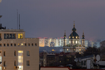 Telephoto view of illuminated St Andrew's Church at night