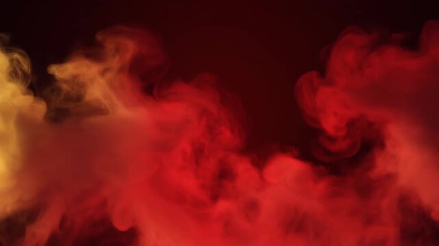 Dramatic red smoke clouds rising in dark background