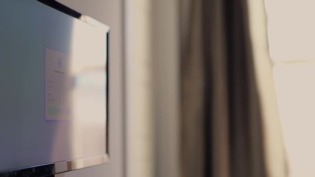 Middle Aged Man Working From Home Remotely is Prompted for Multi Factor Authentication Approval While Signing In Work Computer Cybersecurity Concept