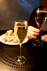 Two glasses of french sparkling wine champagne with little bubbles, New Year celebration, wedding or champagne tour with visit of caves, Reims, France