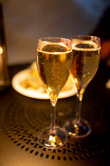 Two glasses of french sparkling wine champagne with little bubbles, New Year celebration, wedding or champagne tour with visit of caves, Reims, France
