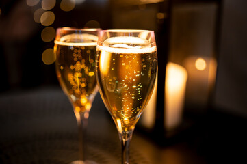 Two glasses of french sparkling wine champagne with little bubbles, New Year celebration, wedding or champagne tour with visit of caves, Reims, France