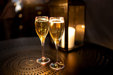 Two glasses of french sparkling wine champagne with little bubbles, New Year celebration, wedding or champagne tour with visit of caves, Reims, France