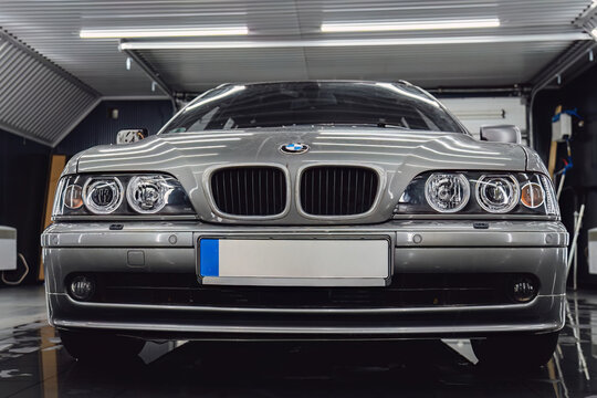 YEREVAN, ARMENIA - DECEMBER 26, 2023: BMW 5-Series Touring (E39 station wagon) after professional polishing service. Premium family estate car in a clean auto repair shop bay after detailing