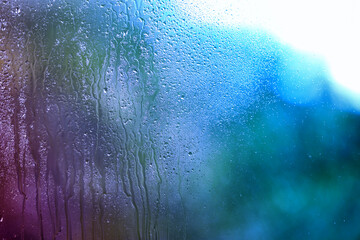 Glass surface with water drops, closeup view