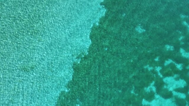 Aerial View of Crystal Clear Turquoise Water in Lake Ohrid: A Scenic Summer Travel Destination in Macedonia, Europe