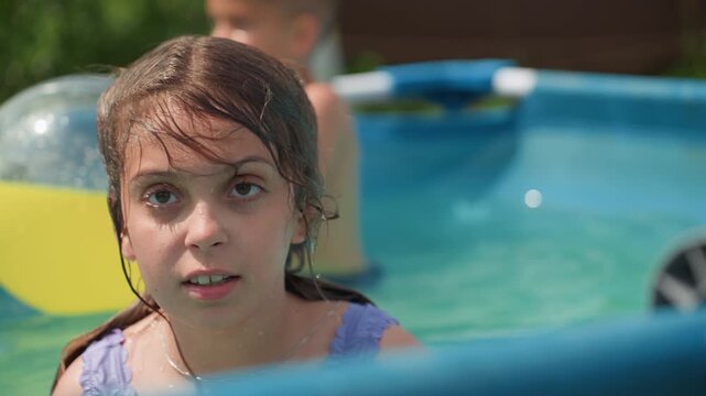 Reflective Summer Gaze, Portrait Of Woman With Wet Hair In Tranquil Pool Setting, Closeup Of Contemplative Woman With Damp Hair Relaxing During Peaceful Summer Afternoon In Swimwear