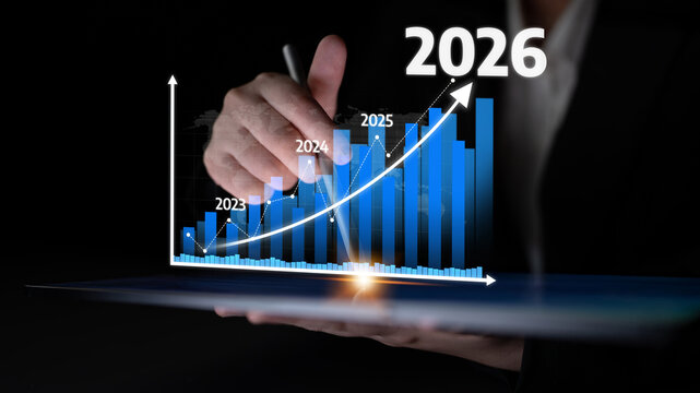 A business professional aims for growth by illustrating a rising graph trend on a transparent screen, representing forecasts from 2023 to 2026. Tessel