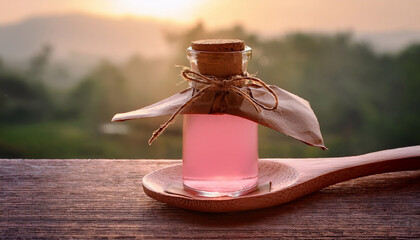 Pink Glass Bottle Wrapped Kraft Paper Atop Wooden Spoon Bathed Soft Warm Morning Light Rustic Wooden