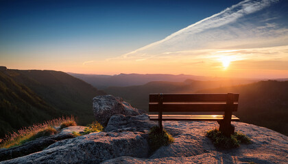 Sunset In The Mountains On The Cliff There Is A Bench