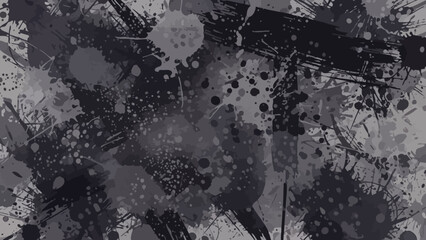 Abstract grunge background with black and grey paint splatters and ink stains, creating a distressed and artistic texture.