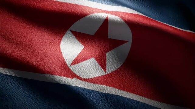波打つ北朝鮮国旗の布地質感を捉えたクローズアップ表現