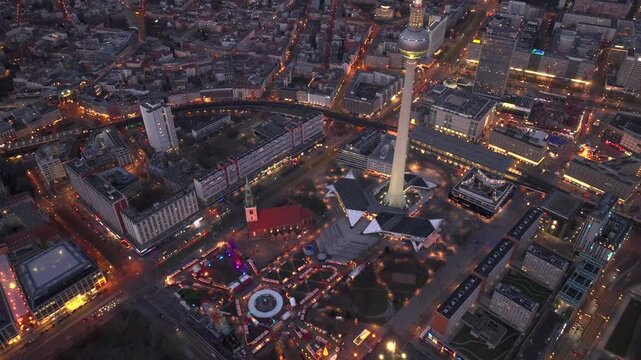 Christmas market in Berlin, Germany, Alexanderplatz at Winter Night, Aerial. Illuminated Weihnachtsmarkt in Berlin-mitte