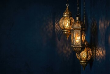 Traditional Ramadan lanterns hanging against blue wall