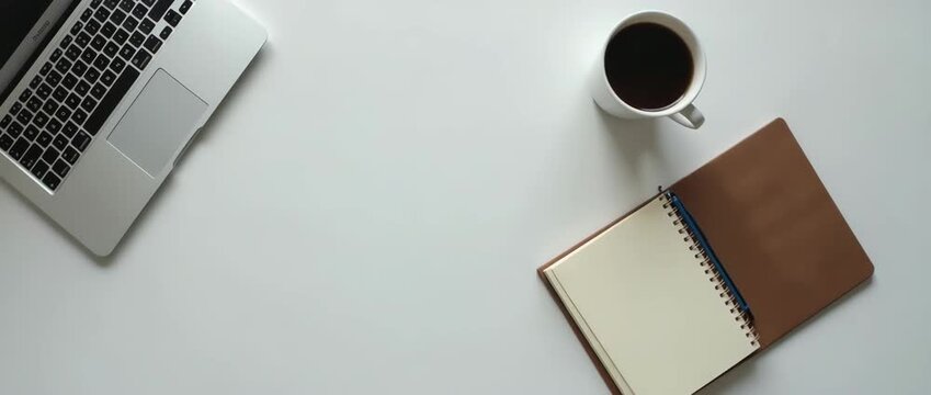 Minimalist office desk setup with a laptop, notepad, and coffee cup as sunlight gently shifts; slow, cinematic pan captures the serene workspace, ideal for productivity and inspiration themes.