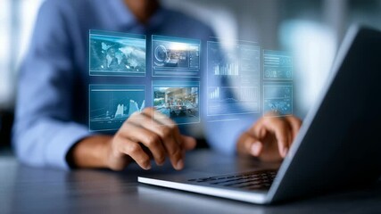 Person works on laptop surrounded by transparent digital interfaces showing data analytics, graphs. Scene highlights technology, innovation, data driven business solutions in contemporary workspace - Powered by Adobe