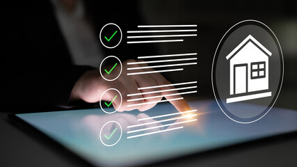 A close-up of a hand interacting with a touchscreen tablet featuring check marks and a house icon, symbolizing digital organization and real estate management. Gantry