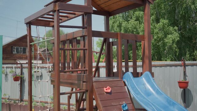 Bright Play Zone, Sunlit Outdoor Kids Activity Space, Illuminated Wooden Climbing Structure For Children, Sunny Outdoor Playground Equipped With Slides And Climbing Features For Children