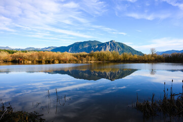 Winter view across Borst Lake of Mount Si reflecting in calm water