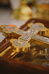 Golden orthodox cross with christ figure reflecting light
