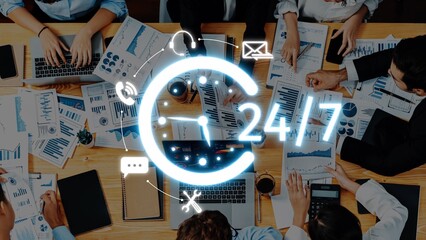 A vibrant office scene showcasing a team engaged in collaborative work, analyzing data and charts on digital devices, symbolizing 24-hour dedication to business excellence. Raster