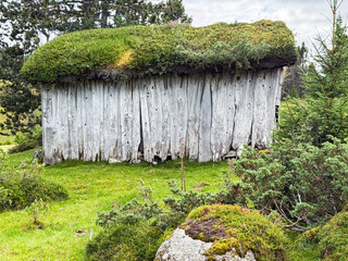 Traditional norwegian sod roof hut in vestland