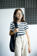 Happy girl in glasses smiling confidently, symbolizing healthy teeth, positive dental care attitude...