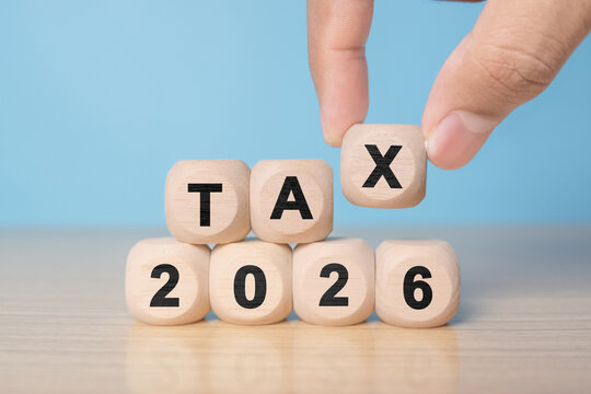 TAX in 2026 concept, on wooden block. State taxes,tax payment, governant ,calculating finance, tax accounting, statistics and data analytic reserach, calculation tax return, strategy plan, report