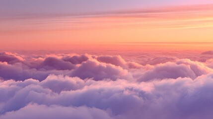 Soft, fluffy cumulus clouds blanket the horizon during a vibrant twilight period.