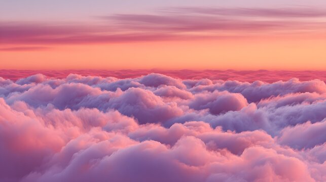 Thick layer of soft clouds illuminated by vibrant sunset hues viewed from above - Powered by Adobe