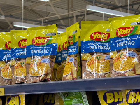 BELO HORIZONTE, MG, BRAZIL. DECEMBER 06, 2025. Yoki Parmesan Extra Fine Straw Potatoes on Supermarket Shelf