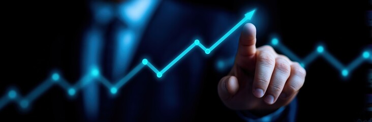 Blue arrow graph pointing upward with hand touching screen for business growth and financial success in dark background investment concept