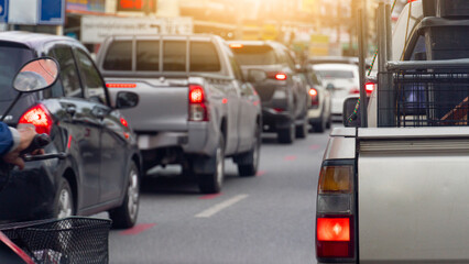 Rear side view of pickup car with railings or other items on the truck. With turn on brake light....