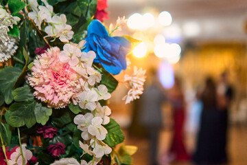 Colorful lighting in a classic space, for parties and celebrations. Colored lights, decorations, flowers, reflections, etc. to illuminate and dance on the dance floor.