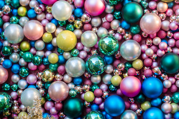 Flat wall with shiny colorful and different size Christmas Bauble Decorations.