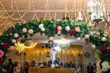 Colorful lighting in a classic space, for parties and celebrations. Colored lights, decorations, flowers, reflections, etc. to illuminate and dance on the dance floor.