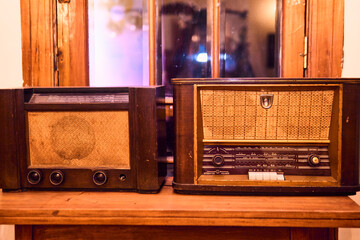 A view of very colorful antique broadcast radios from different eras. Transmitters, colors, styles, vintage, etc. In good condition and working order, reconditioned and recycled. nostalgia