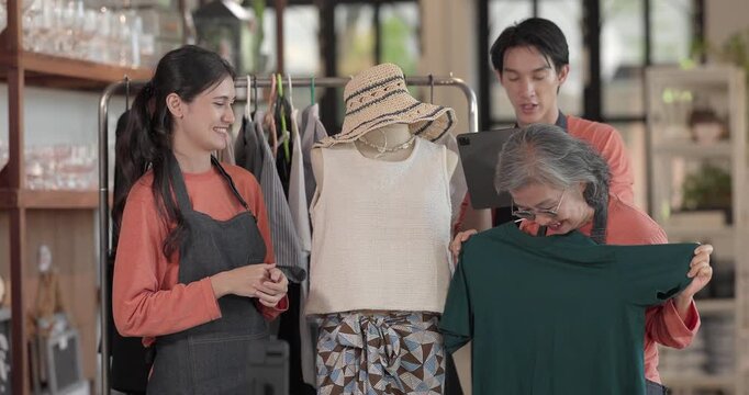 A mother, son, and daughter from a family business host a live stream, showcasing ceramic products on camera while managing orders and engagement for e commerce sales.
