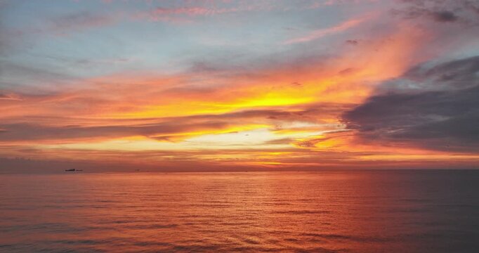 Golden sunrise over the sea horizon and waves video