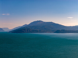 Lake Garda distant mountains over blue water - Sirmione, Italy