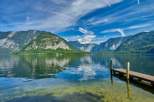 High angle view of Lake Hallstatt and surrounding mountains of Austrian Alps with the town of Hallstatt on the bank and town of Obertraun in distance, Salzkammergut, Hallstatt, Austria, Europe