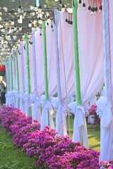 vintage light bulb hang on white curtain of party in the evening