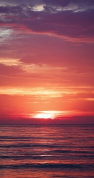 Golden Sunset Over The Ocean Waves A Silhouette flying seagull birds and Ship On The Horizon At Dusk