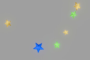 灰色の背景にたくさんのカラフルな星